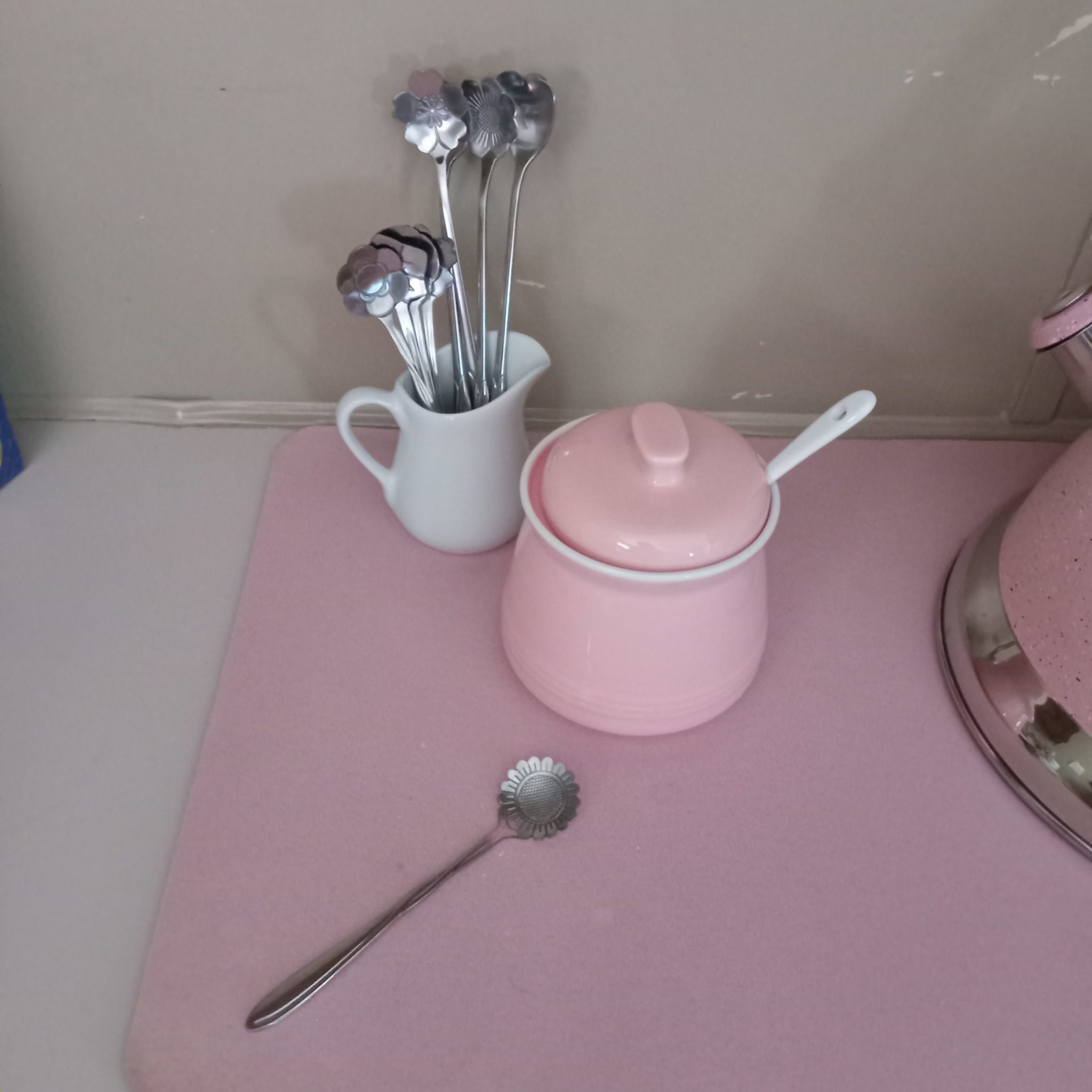 pink sugar bowl with lid and spoon