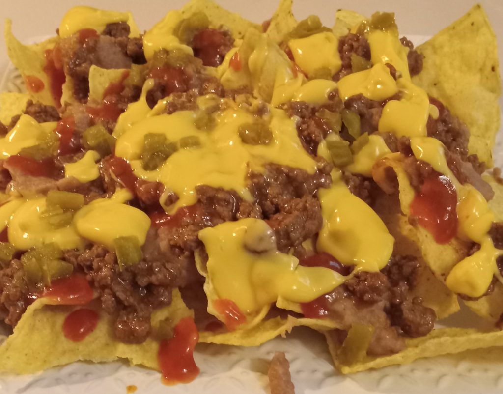 fully loaded nachos, nachos with ground beef, spicy nachos recipe, nachos with cheese sauce, nachos with jalapenos, easy party nachos, loaded nacho recipe, nacho toppings, homemade nachos, best nachos for parties