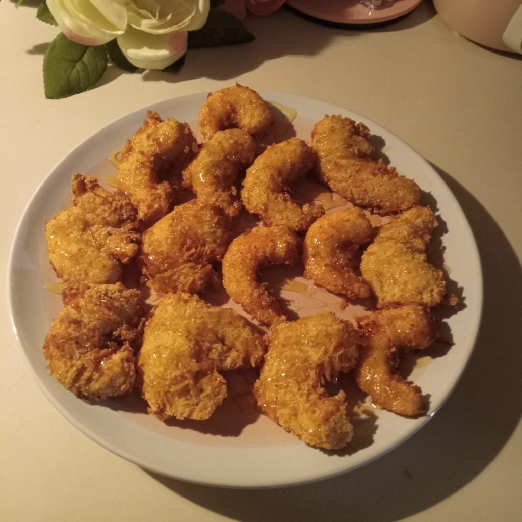 Golden honey coconut shrimp, crispy coconut shrimp, honey coconut shrimp recipe, fried coconut shrimp with honey, coconut crusted shrimp, shrimp appetizer, sweet coconut shrimp, golden coconut shrimp, fried shrimp recipe