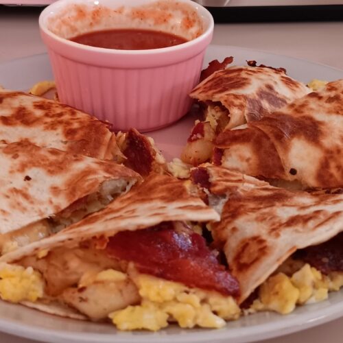 Bacon Egg Potato Cheese Quesadilla Tex Mex breakfast recipe Southern breakfast ideas Easy quesadilla recipe Breakfast quesadillas Cheesy bacon quesadilla Comfort food recipes Breakfast ideas with bacon Fluffy scrambled eggs recipe Fried potato recipes