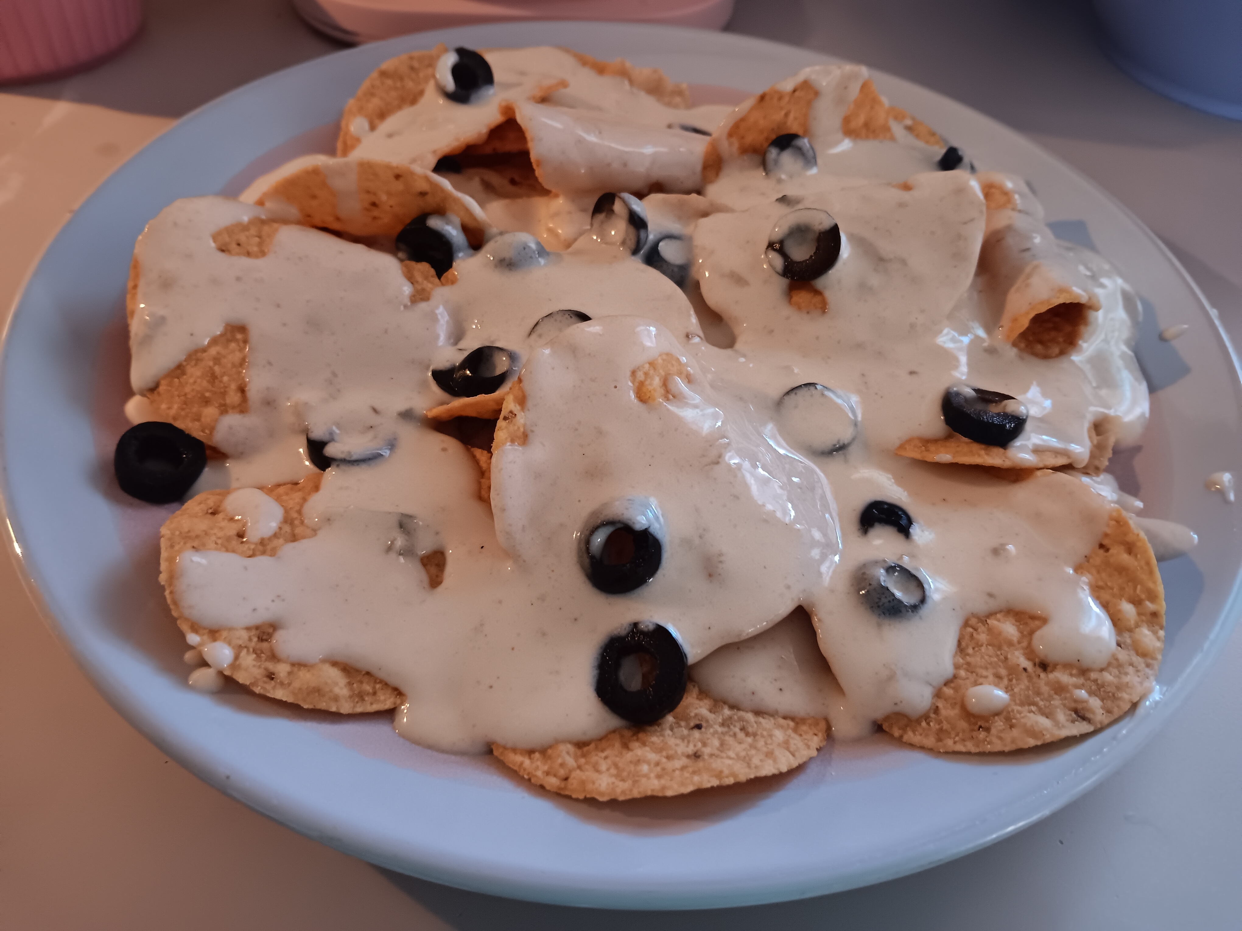 white queso nachos easy nachos recipe simple queso nachos homemade queso dip nacho cheese dip tortilla chips nachos quick snack ideas nacho toppings black olives nachos queso nachos with olives Simple White Queso Nachos