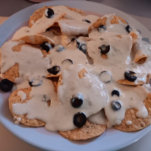 white queso nachos easy nachos recipe simple queso nachos homemade queso dip nacho cheese dip tortilla chips nachos quick snack ideas nacho toppings black olives nachos queso nachos with olives Simple White Queso Nachos